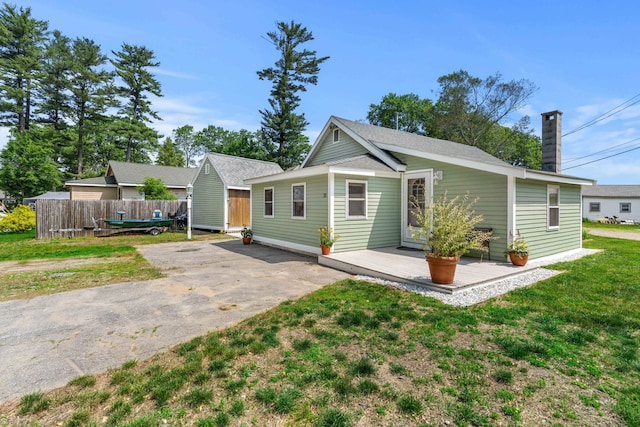 20 Circuit Dr, Kingston, NH 03848 - bungalow-style house with a chimney, driveway, and a wooden deck