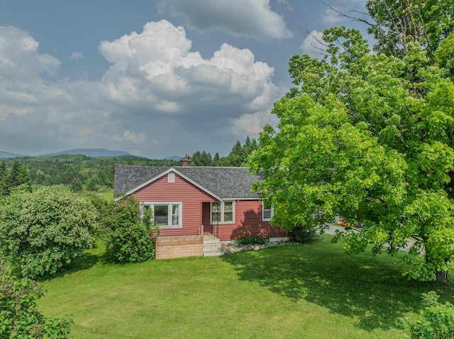 336 N Rd, Lancaster, NH 03584 - view of front of home featuring a shingled roof, a front lawn, and a chimney