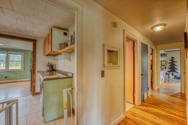 336 N Rd, Lancaster, NH 03584 - hallway featuring a baseboard heating unit, light wood-style flooring, and baseboards