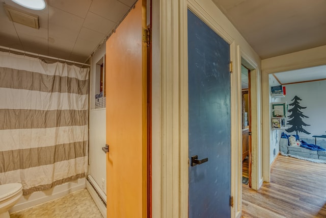 336 N Rd, Lancaster, NH 03584 - full bath featuring a baseboard radiator, toilet, and wood finished floors