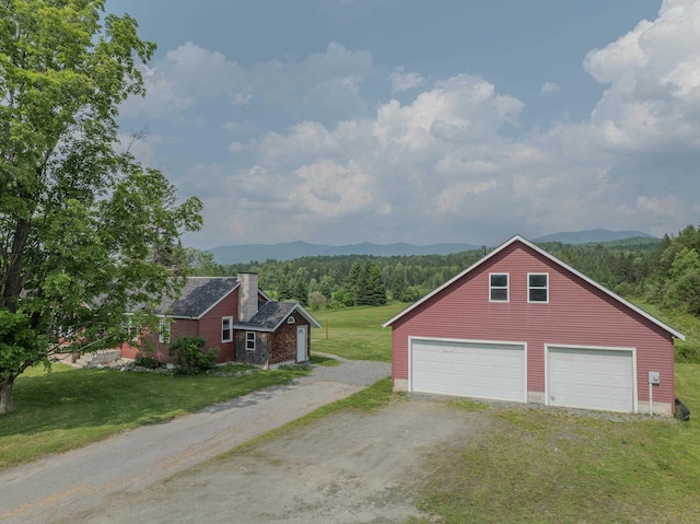 336 N Rd, Lancaster, NH 03584 - detached garage with a mountain view and dirt driveway