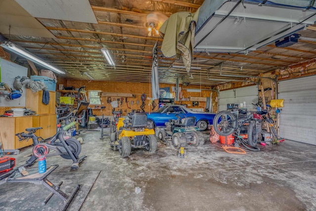 336 N Rd, Lancaster, NH 03584 - garage featuring a garage door opener and a workshop area