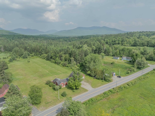 336 N Rd, Lancaster, NH 03584 - aerial view of sparsely populated area featuring a heavily wooded area and a mountainous background