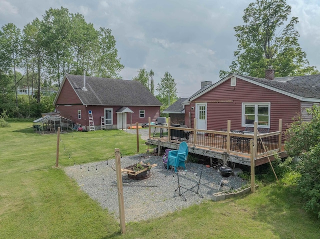 336 N Rd, Lancaster, NH 03584 - back of house featuring a chimney, a deck, a yard, and roof with shingles