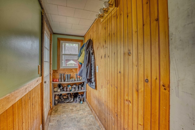 336 N Rd, Lancaster, NH 03584 - hallway with wooden walls and stone finish floors