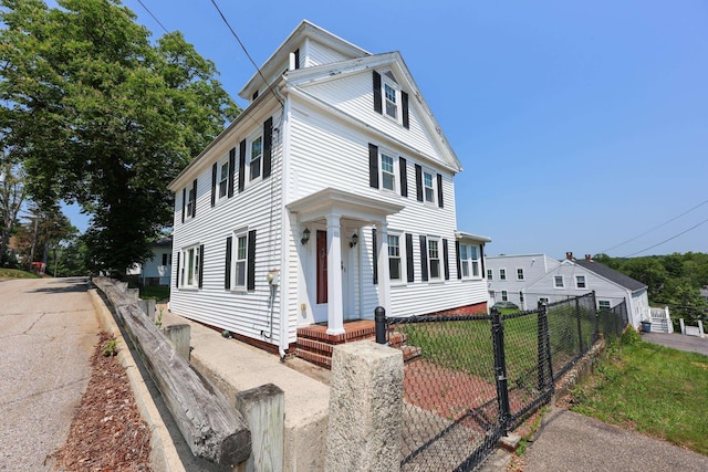 11 Linden St, Somersworth, NH 03878 - view of front facade with a fenced front yard