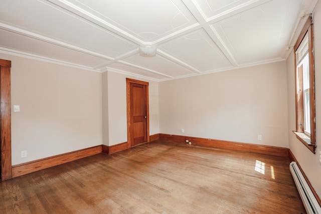 11 Linden St, Somersworth, NH 03878 - empty room with a baseboard radiator, light wood-style flooring, baseboards, coffered ceiling, and ornamental molding