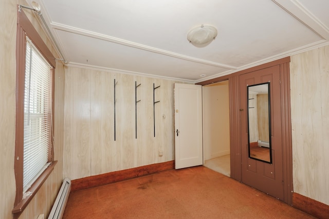 11 Linden St, Somersworth, NH 03878 - unfurnished room featuring a baseboard radiator, carpet flooring, ornamental molding, and wooden walls