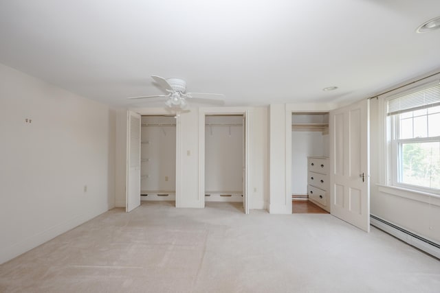 11 Linden St, Somersworth, NH 03878 - unfurnished bedroom with a baseboard heating unit, multiple closets, light colored carpet, recessed lighting, and ceiling fan