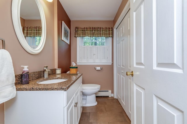 50 Kienia Rd, Hudson, NH 03051 - bathroom featuring baseboard heating, vanity, toilet, tile patterned flooring, and baseboards