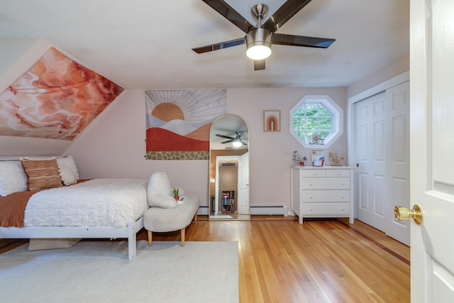 50 Kienia Rd, Hudson, NH 03051 - bedroom featuring baseboard heating, wood finished floors, a ceiling fan, and vaulted ceiling
