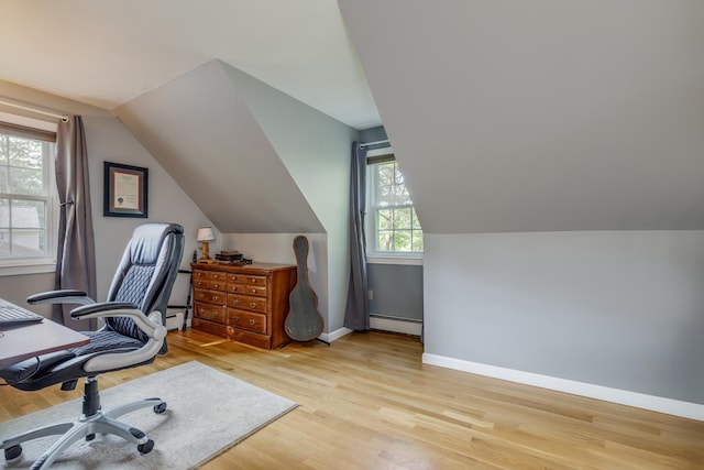 50 Kienia Rd, Hudson, NH 03051 - home office with a baseboard heating unit, wood finished floors, vaulted ceiling, and baseboards