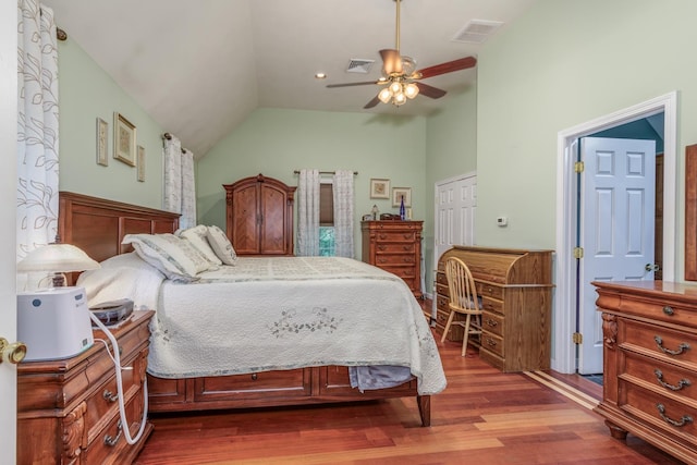 50 Kienia Rd, Hudson, NH 03051 - bedroom featuring wood finished floors, lofted ceiling, a ceiling fan, and a closet