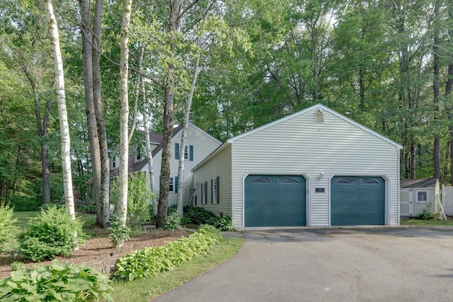50 Kienia Rd, Hudson, NH 03051 - view of home's exterior featuring a garage and driveway