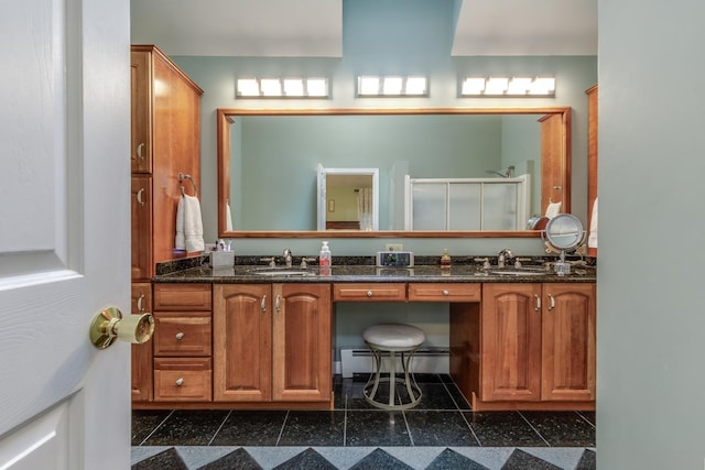 50 Kienia Rd, Hudson, NH 03051 - full bath featuring granite tiled floors, double vanity, a baseboard radiator, and a shower stall