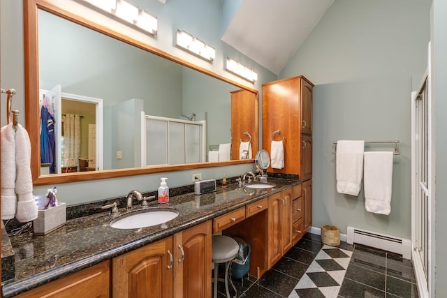 50 Kienia Rd, Hudson, NH 03051 - bathroom with a baseboard heating unit, granite tiled floors, double vanity, a shower stall, and baseboards
