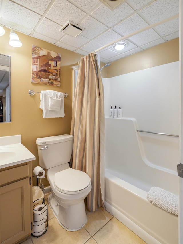 137 E Mountain Rd Unit 2A3, Killington, VT 05751 - bathroom featuring a drop ceiling, vanity, shower / tub combo with curtain, toilet, and tile patterned flooring