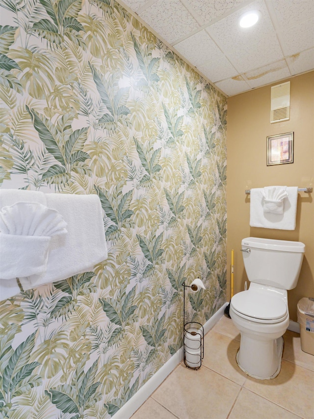 137 E Mountain Rd Unit 2A3, Killington, VT 05751 - bathroom with wallpapered walls, baseboards, toilet, a paneled ceiling, and tile patterned floors
