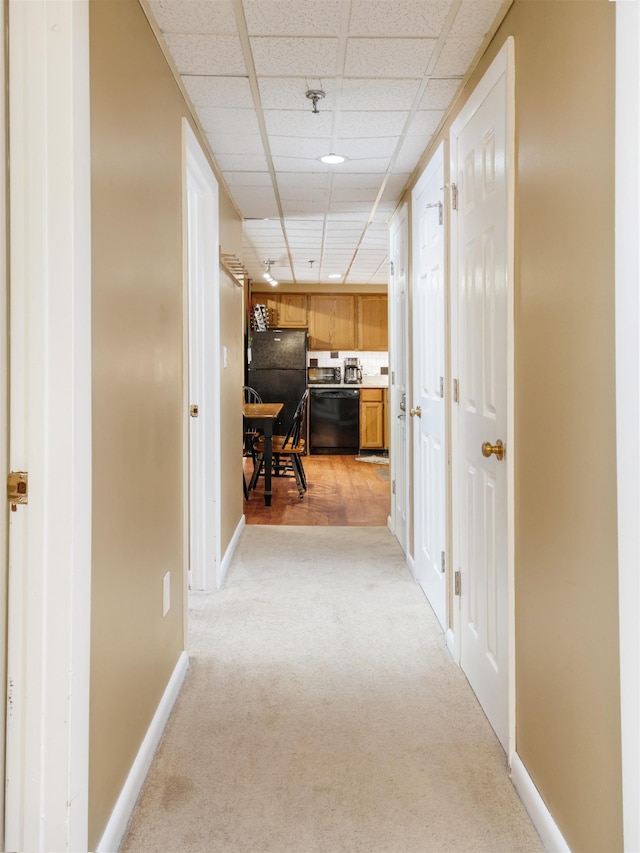 137 E Mountain Rd Unit 2A3, Killington, VT 05751 - corridor with light colored carpet, baseboards, and a paneled ceiling