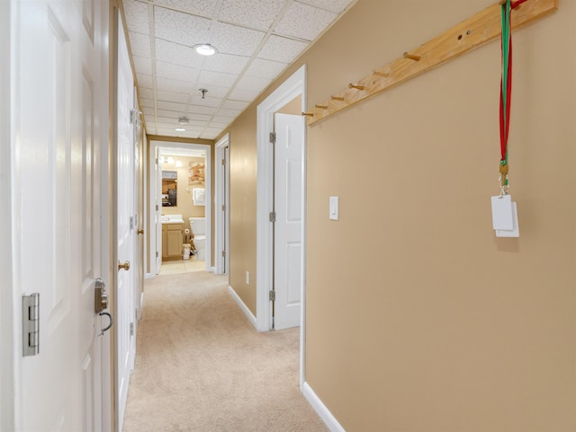 137 E Mountain Rd Unit 2A3, Killington, VT 05751 - hallway with light colored carpet, baseboards, and a paneled ceiling