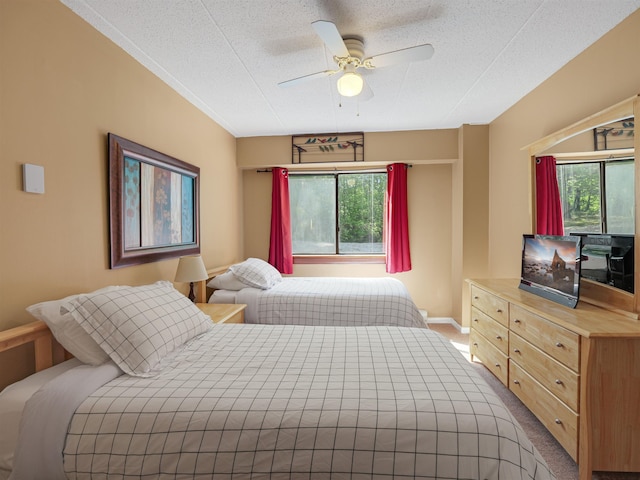 137 E Mountain Rd Unit 2A3, Killington, VT 05751 - bedroom with carpet, a textured ceiling, and a ceiling fan
