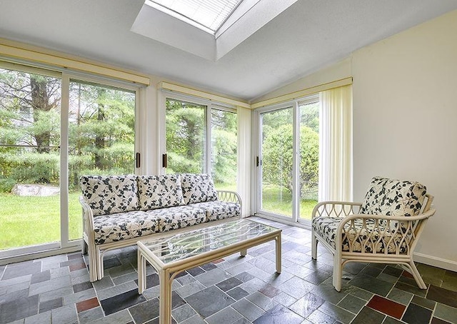1 Wesley Ln, Keene, NH 03431 - sunroom / solarium featuring a skylight, lofted ceiling, stone tile floors, and baseboards