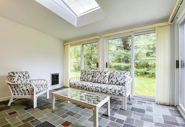 1 Wesley Ln, Keene, NH 03431 - sunroom / solarium featuring a skylight, heating unit, stone finish flooring, and baseboards
