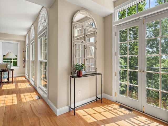 200 Lake St Unit 16, Burlington, VT 05401 - doorway to outside with wood finished floors, baseboards, and french doors
