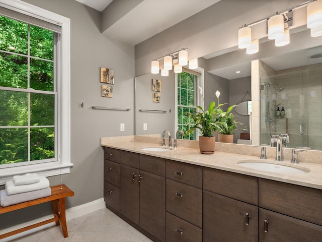 200 Lake St Unit 16, Burlington, VT 05401 - full bath featuring baseboards, double vanity, and a stall shower