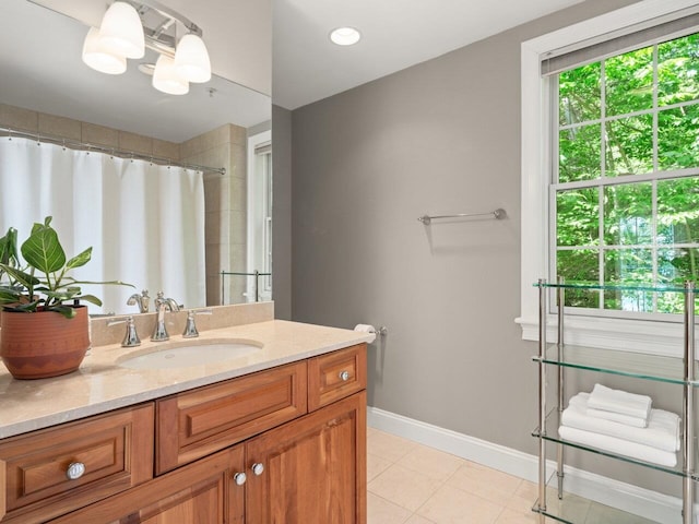 200 Lake St Unit 16, Burlington, VT 05401 - full bathroom featuring vanity, baseboards, a shower with curtain, and tile patterned floors