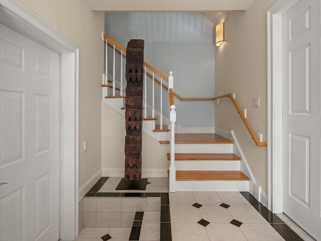 200 Lake St Unit 16, Burlington, VT 05401 - stairs with inlaid floor details, baseboards, and tile patterned floors
