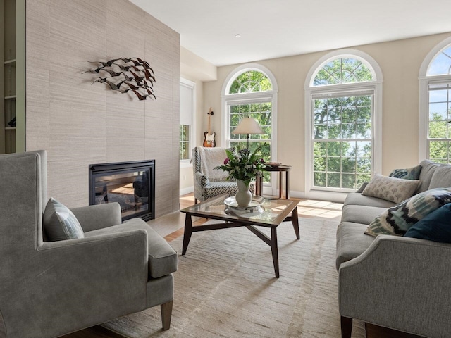 200 Lake St Unit 16, Burlington, VT 05401 - living room featuring a tile fireplace and light wood-style flooring