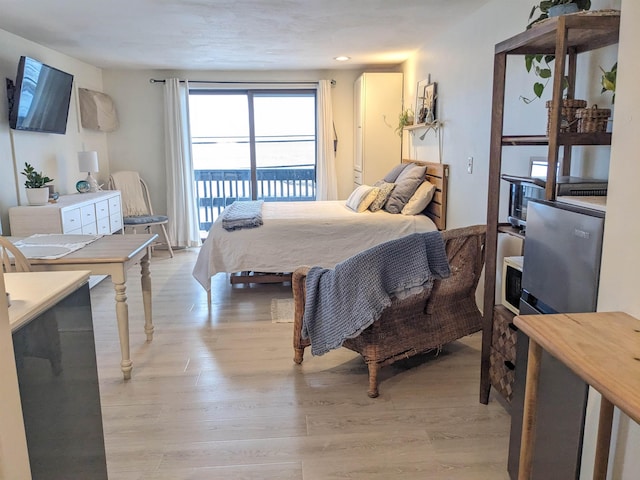 415 Ocean Blvd Unit 1D, Hampton, NH 03842 - bedroom featuring access to exterior, light wood-type flooring, and recessed lighting