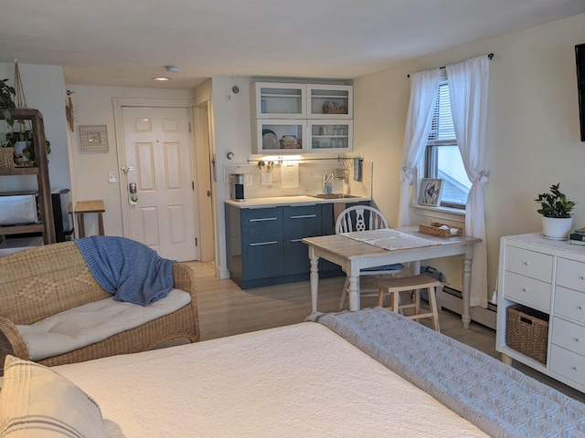 415 Ocean Blvd Unit 1D, Hampton, NH 03842 - dining space featuring light wood-style flooring and a baseboard radiator