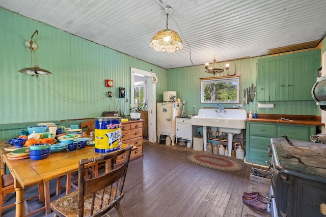 9 Laurel St, Whitefield, NH 03598 - dining area with wood-type flooring and wooden walls