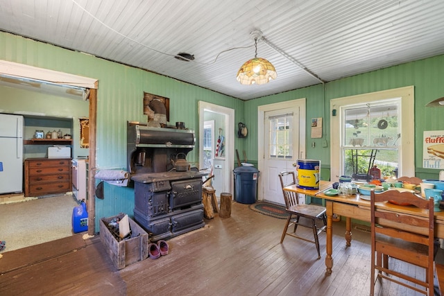 9 Laurel St, Whitefield, NH 03598 - office area with a wood stove and hardwood / wood-style flooring