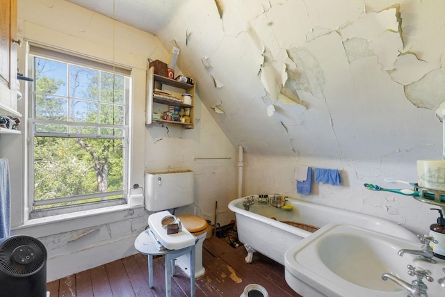 9 Laurel St, Whitefield, NH 03598 - bathroom with a freestanding tub, healthy amount of natural light, hardwood / wood-style floors, and lofted ceiling