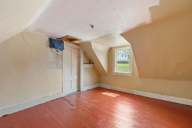 9 Laurel St, Whitefield, NH 03598 - bonus room with wood-type flooring, vaulted ceiling, and baseboards