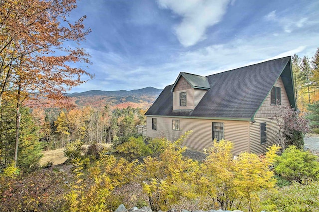 105 Valley View Rd, Easton, NH 03580 - view of side of property with a mountain view and roof with shingles