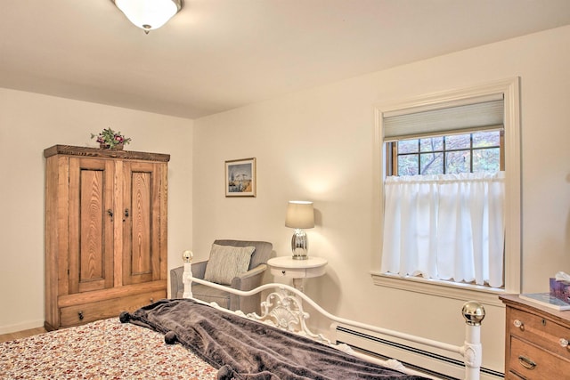 105 Valley View Rd, Easton, NH 03580 - bedroom with a baseboard radiator and wood finished floors