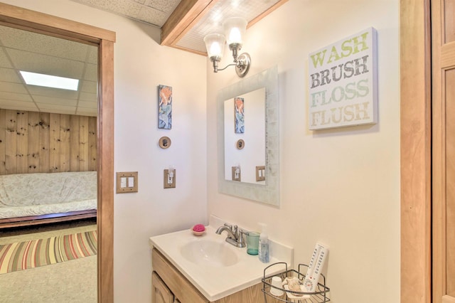105 Valley View Rd, Easton, NH 03580 - bathroom with vanity, a paneled ceiling, and ensuite bath