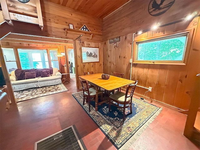 422/431 Little Rutland Rd, Castleton, VT 05735 - dining room with wooden walls, healthy amount of natural light, wooden ceiling, and lofted ceiling