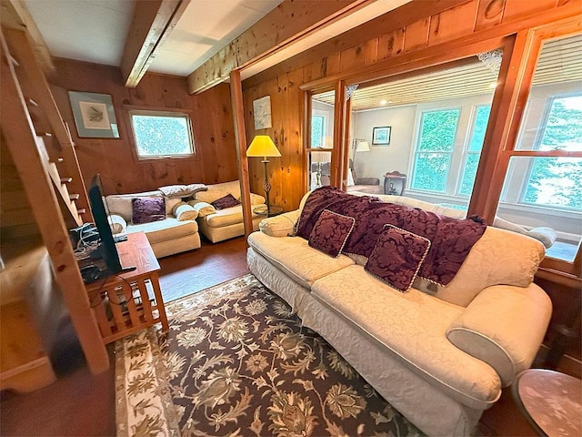 422/431 Little Rutland Rd, Castleton, VT 05735 - living area featuring wood walls, beamed ceiling, and wood finished floors