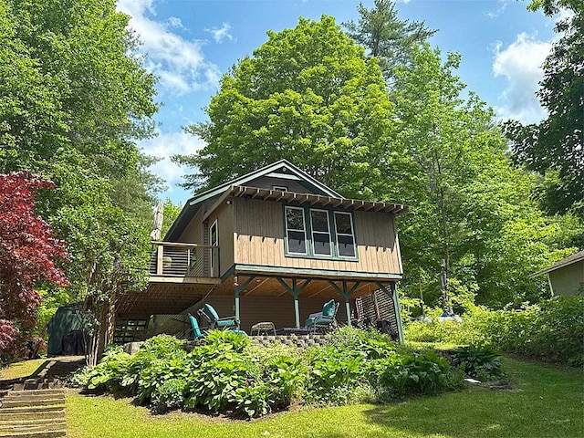 422/431 Little Rutland Rd, Castleton, VT 05735 - rear view of property with a wooden deck and stairs
