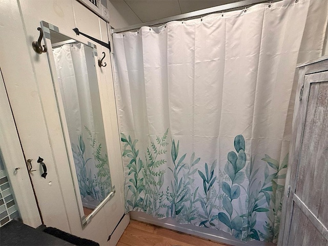 422/431 Little Rutland Rd, Castleton, VT 05735 - bathroom with wood finished floors and curtained shower
