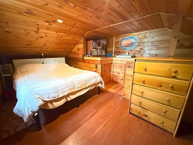 422/431 Little Rutland Rd, Castleton, VT 05735 - bedroom with vaulted ceiling, wood ceiling, wood walls, and light wood finished floors
