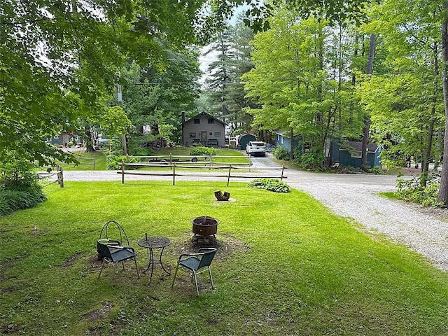 422/431 Little Rutland Rd, Castleton, VT 05735 - view of grassy yard featuring an outdoor fire pit