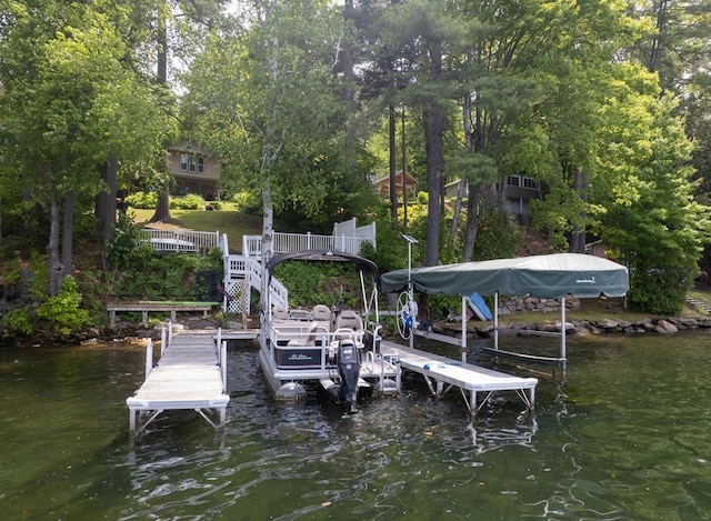 422/431 Little Rutland Rd, Castleton, VT 05735 - dock area with a water view, boat lift, and view of scattered trees