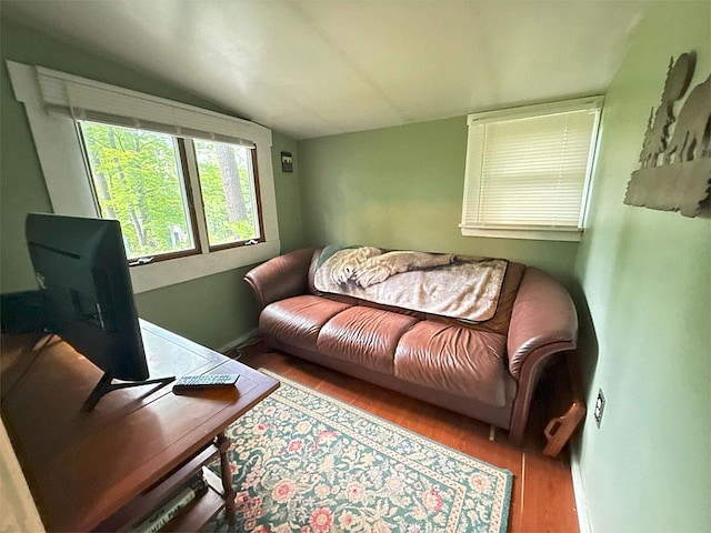 422/431 Little Rutland Rd, Castleton, VT 05735 - living area featuring vaulted ceiling and wood finished floors