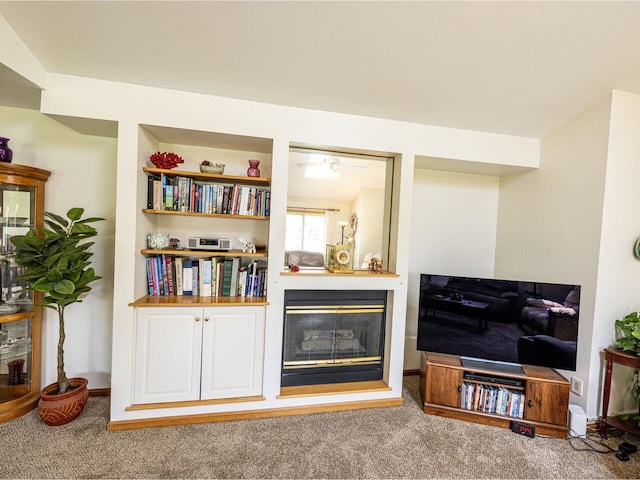 115 Meadow Run Rd, Williston, VT 05495 - living area with carpet floors, a glass covered fireplace, and baseboards